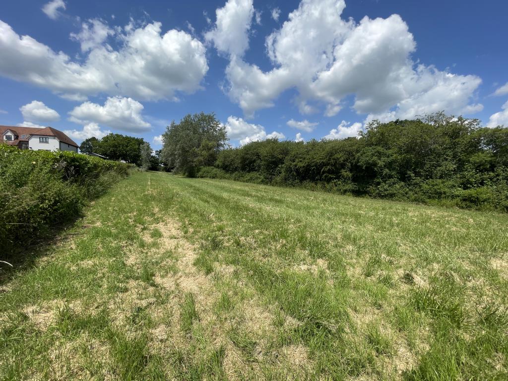 Lot: 46 - JUST OVER AN ACRE OF FREEHOLD LAND WITH POTENTIAL FOR VARIETY OF USES - External view looking west